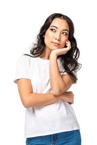 Pensive young asian woman in white t-shirt holding hand under chin isolated on white
