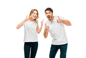 happy young couple showing thumbs up and smiling at camera isolated on white