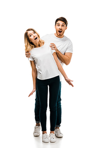 full length view of surprised young couple in white t-shirts  isolated on white