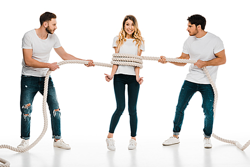 young men holding rope wrapped around smiling young woman showing thumbs up and  isolated on white