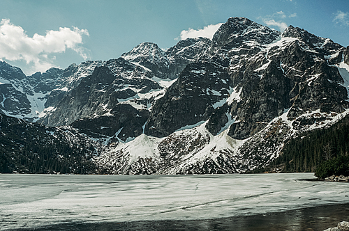 Frozen winter lake in scenic mountains, Morskie Oko, Sea Eye, Tatra National Park, Poland