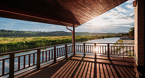 wide shot of of beautiful  over river from wooden terrace