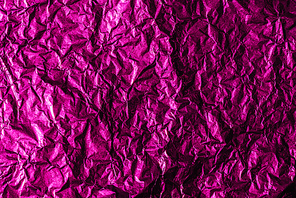 beautiful shiny abstract crumpled violet foil background