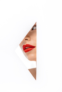 beautiful young woman red red lips looking away, view through hole on white