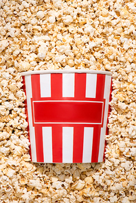 flat lay with disposable bucket and crunchy popcorn