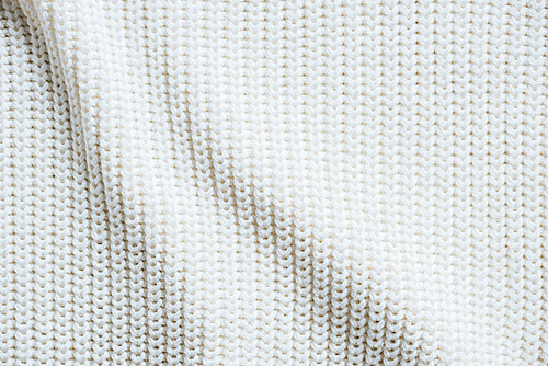 full frame image of white woolen fabric background