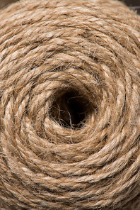 full frame image of circle made by beige string background