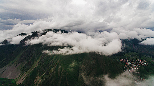 aerial view of green scenic mountains with clouds, Georgia