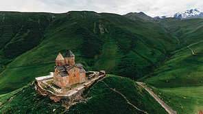 aerial view of old castle in green mountains, Georgia