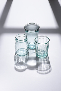 close up view of empty glassware on white surface