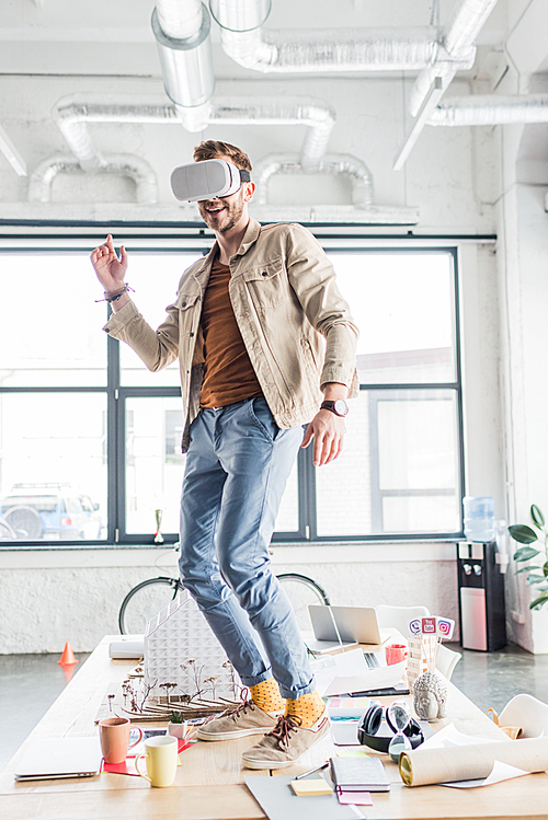 male architect gesturing with hands while having virtual reality experience in loft office