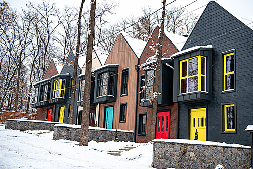stylish modern buildings in cold winter with snow on ground
