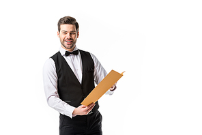 portrait of smiling waiter in suit vest with menu isolated on white