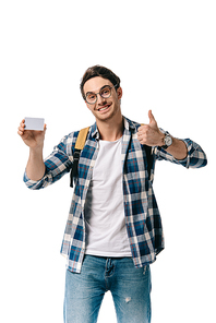 handsome student holding credit card and showing thump up isolated on white