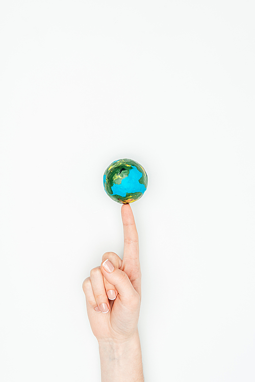 cropped image of woman touching earth model isolated on white, earth day concept
