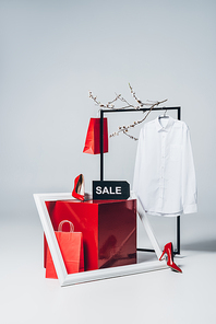 red cube, high heels, frame and sale sign, summer sale concept