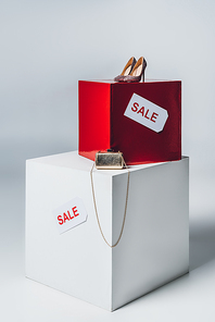 handbag, high heels and sale signs, summer sale concept