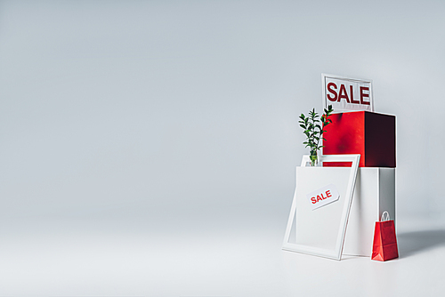 red and white cubes, paper bag and sale signs, summer sale concept