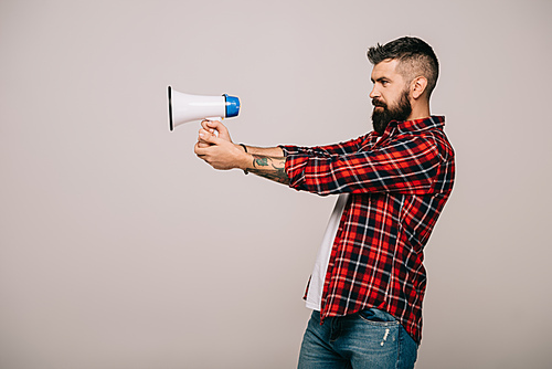 bearded man in checkered shirt holding megaphone, isolated on grey