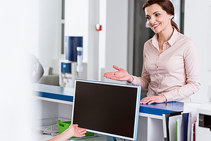 Smiling patient talking to nurse in clinic