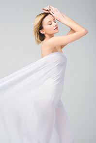 tender naked girl posing in elegant white veil, isolated on grey