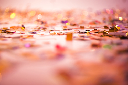 selective focus of pink and golden confetti background