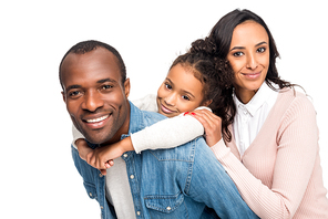happy african american family hugging and smiling at camera isolated on white