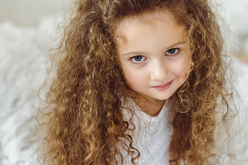 portrait of adorable curly kid 