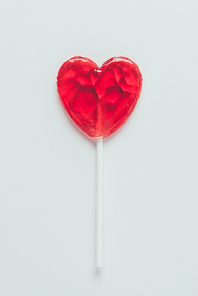 top view of heart shaped lollipop isolated on white