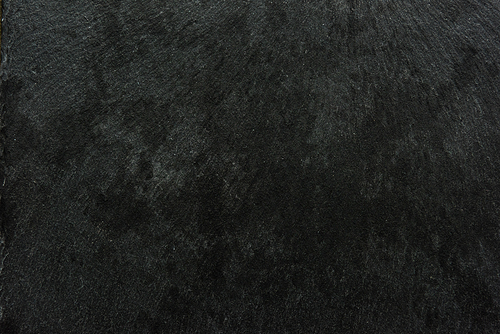 Dark textured surface abstract background