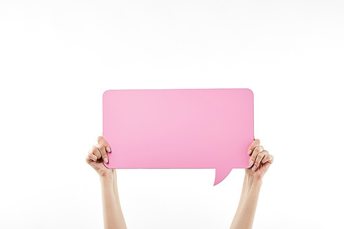 cropped view of woman with pink speech bubble in hands isolated on white