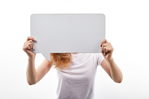 woman with speech bubble in hands standing isolated on white