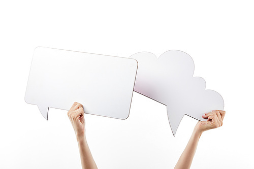cropped view of woman with thought and speech bubbles in hands, isolated on white