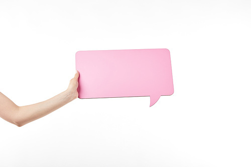 cropped view of woman with pink speech bubble in hand isolated on white