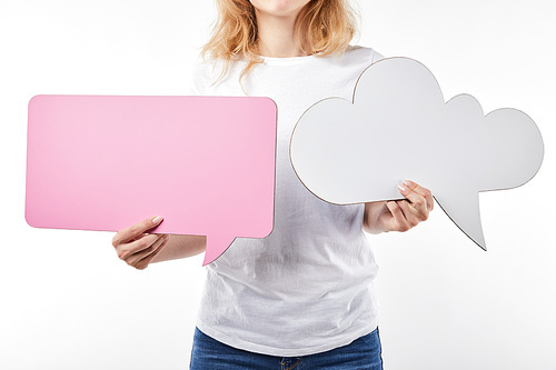 cropped view of woman with pink speech bubble and thought bubble in hands isolated on white
