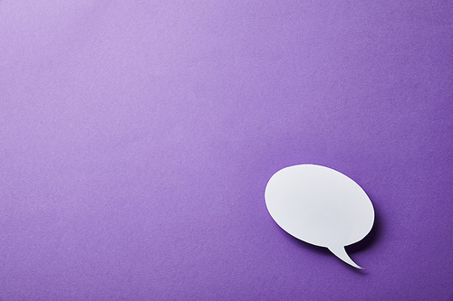 white speech bubble card on purple surface