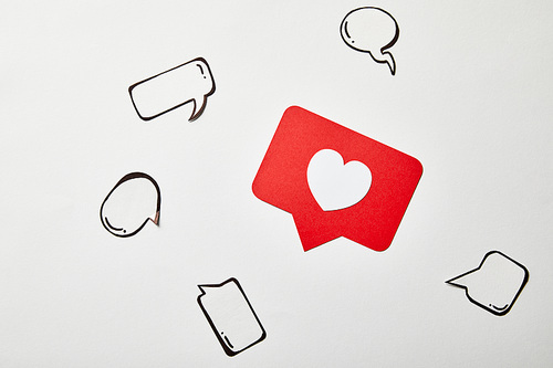 red like sign card with thought and speech bubbles on white surface
