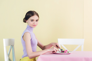 beautiful teen girl eating tulip, diet concept