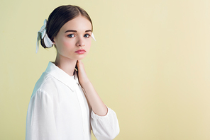 styling teen girl posing in white outfit, isolated on yellow