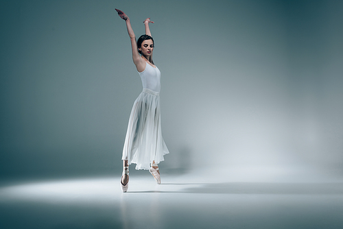 female ballet dancer in white dress