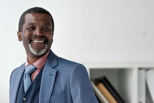 smiling mature african american man in blue jacket