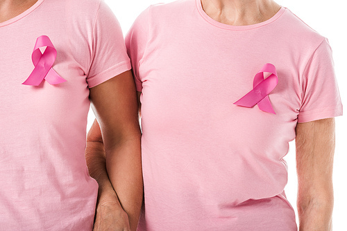 cropped shot of women with pink ribbons holding hands isolated on white, breast cancer awareness concept