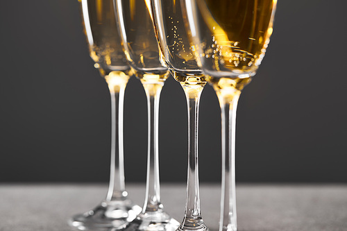 champagne in glasses for celebrating christmas eve on grey