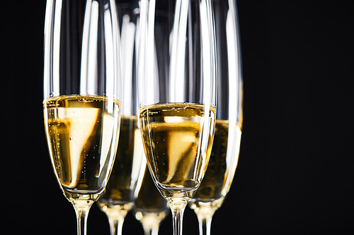 close up of champagne glasses for celebrating christmas, isolated on black