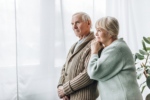 senior couple standing together at home