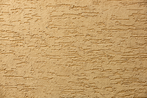 close-up view of light brown concrete wall textured background