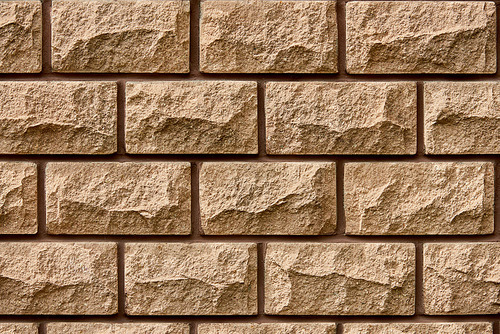 full frame view of brown brick wall textured background