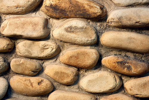 close-up view of rough stone wall textured background