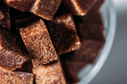 close up view of sweet unrefined brown sugar cubes