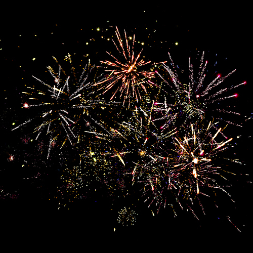 traditional festive fireworks in night sky, isolated on black